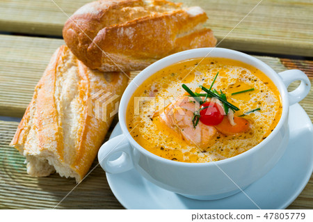 Cream soup with salmon with bread Cream soup with salmon with bread 47805779