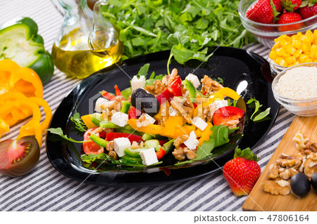 Plate with ready-made salad and its ingredients for recipe Plate with ready-made salad and its ingredients for recipe 47806164
