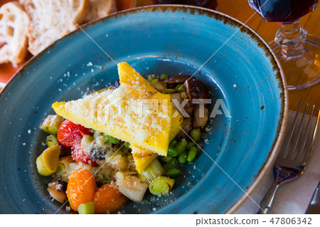 Delicious mushrooms served with baked vegetables 47806342