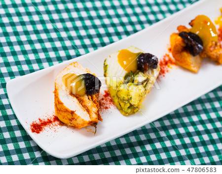 Turkey breast with paprika, prunes and spicy mango sauce 47806583