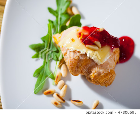 Camembert on mini croissant with jam, pine nuts Camembert on mini croissant with jam, pine nuts 47806693