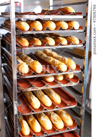 Baked bread on bakery rack Baked bread on bakery rack 47806766