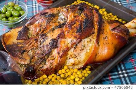 Tasty baked in oven pig ham with garbanzo at plate served Tasty baked in oven pig ham with garbanzo at plate served 47806843