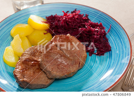 Beef steaks with potatoes and pickled cabbage Beef steaks with potatoes and pickled cabbage 47806849