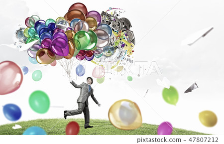 Comedian man with color balloons Comedian man with color balloons 47807212