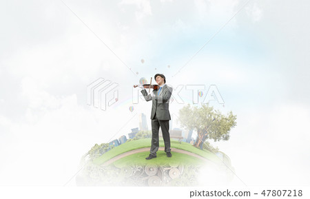 Man playing holiday melody 47807218