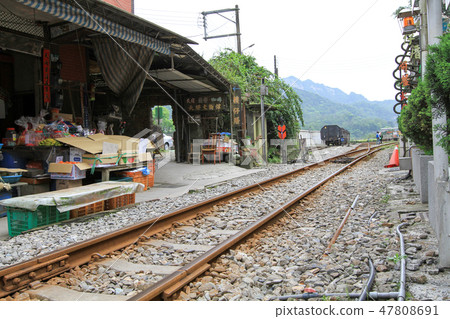 old train is going through the Shifen Village  47808691