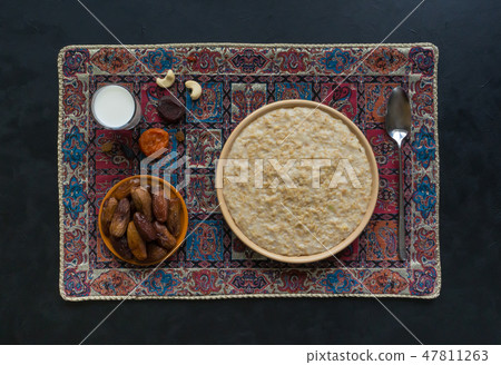 Oatmeal with dates and milk. Ramadan food.  47811263