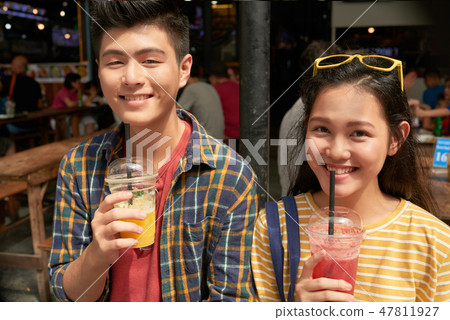 Couple drinking cocktails Couple drinking cocktails 47811927