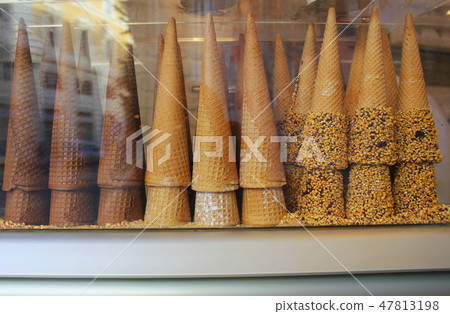 A pile of waffle cones for ice cream ready to be filled with ice cream in a cafe, restaurant A pile of waffle cones for ice cream ready to be filled with ice cream in a cafe, restaurant 47813198