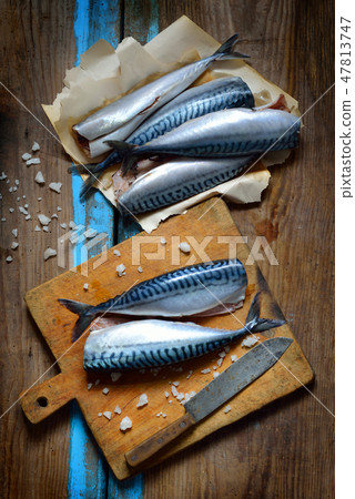 Fresh mackerel on the board. 47813747