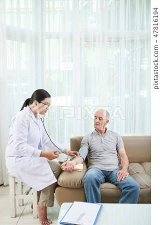 Doctor checking blood pressure Doctor checking blood pressure 47816194