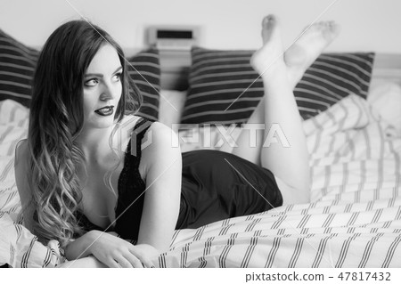 Sexy posing woman in bedroom. Sexy posing woman in bedroom. 47817432