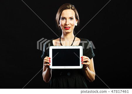woman retro style showing tablet woman retro style showing tablet 47817461