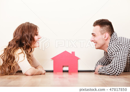 Couple with paper house. Housing real estate. Couple with paper house. Housing real estate. 47817850