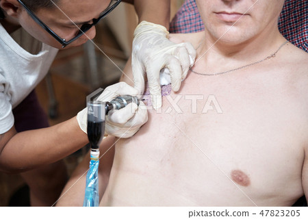 Getting tattoo 47823205