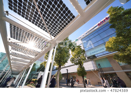 Kawasaki city landscape in Japan Photovoltaic panels installed at taxi shelters in sunlight and Kawasaki station east exit square square 47824389