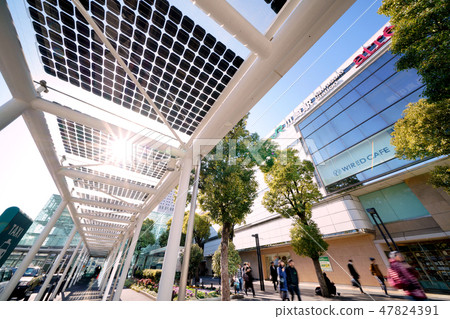 Kawasaki city landscape in Japan Photovoltaic panels installed at taxi shelters in sunlight and Kawasaki station east exit square square 47824391