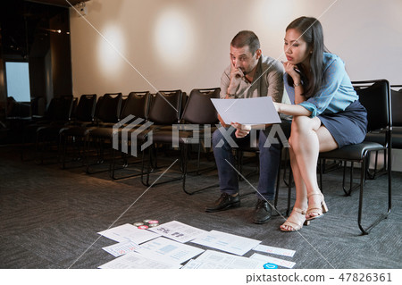 Businessman discussing work with UX designer Businessman discussing work with UX designer 47826361
