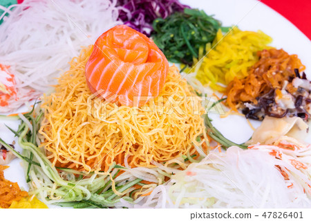 Close-up of Yee Sang or Yusheng with raw fish Close-up of Yee Sang or Yusheng with raw fish 47826401