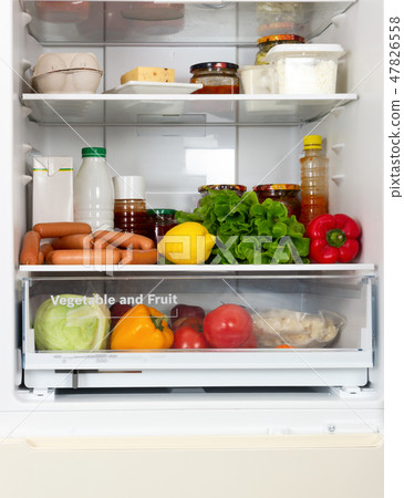 Open fridge full of vegetables and fruits  47826558