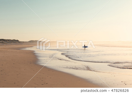 Peniche - Portugal - 26 September 2018 - Surfer running on the beach Peniche - Portugal - 26 September 2018 - Surfer running on the beach 47826826