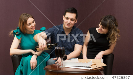 One man in company of two women party, alcohol. 47826867