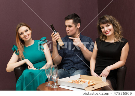 One man in company of two women party, alcohol. 47826869