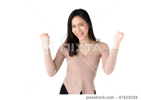 Young Asian woman cheerfully raising her fists 47828288
