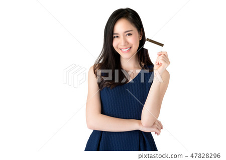 Smiling Asian woman presenting credit card in hand Smiling Asian woman presenting credit card in hand 47828296