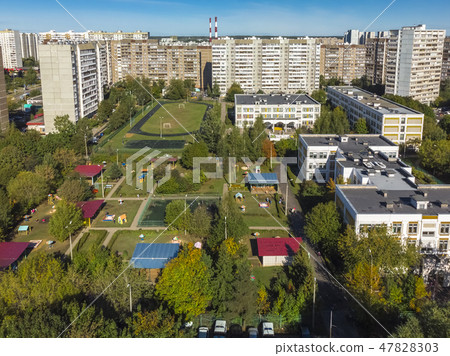 Sleeping area with residential buildings, football field and childrens playgrounds in Moscow, Russia Sleeping area with residential buildings, football field and childrens playgrounds in Moscow, Russia 47828303