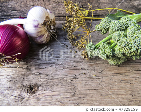 Vegetables on a wooden background. Vegetables on a wooden background. 47829159