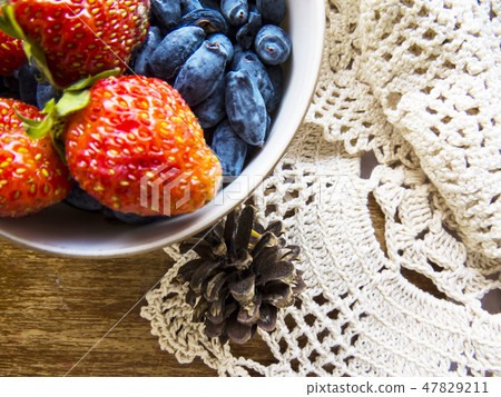 Strawberry on a wooden background. Strawberry on a wooden background. 47829211