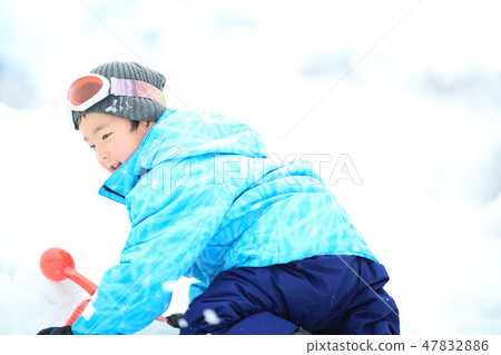 Children enjoying snow 47832886
