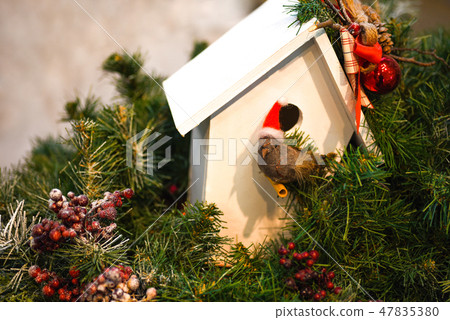 Christmas decoration with a nest in a green tree 47835380