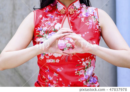 A woman in a Chinese dress A woman in a Chinese dress 47837978