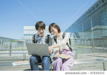 College campus Life college student watching outdoor computer College campus Life college student watching outdoor computer 47838333