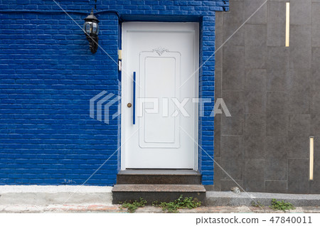 sidewalk by street wall & door sidewalk by street wall & door 47840011