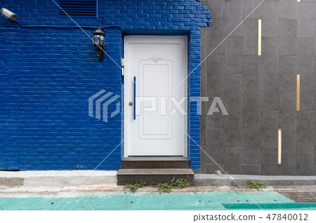 sidewalk by street wall & door sidewalk by street wall & door 47840012
