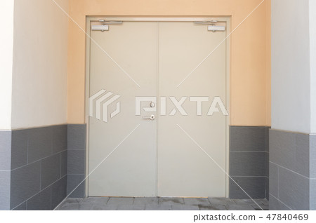 sidewalk by street wall & door sidewalk by street wall & door 47840469