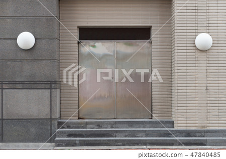 sidewalk by street wall & door sidewalk by street wall & door 47840485