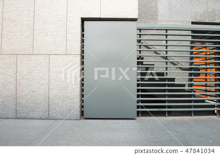 Large blank billboard on a street wall 47841034