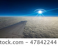 UFO flies near airplane in dark blue sky 47842244