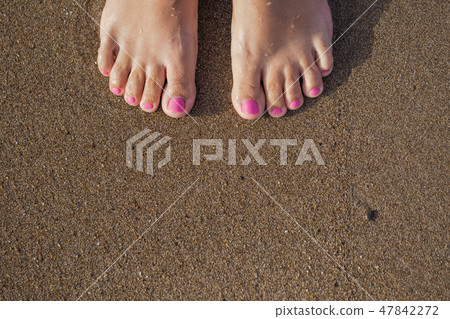 Top view of beautiful female barefeet legs Top view of beautiful female barefeet legs 47842272