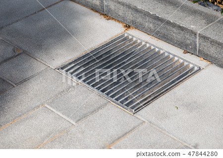 Manhole cover metal in a city street Manhole cover metal in a city street 47844280