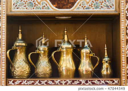 Eastern pitchers stand on a shelf in an Arab shop Eastern pitchers stand on a shelf in an Arab shop 47844349