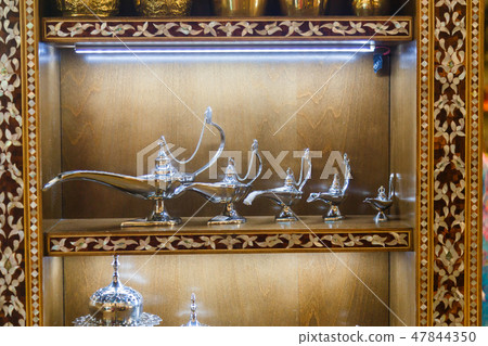 Aladdin lamp on shelf. Ramadan background. Ramadan kareem. Aladdin lamp on shelf. Ramadan background. Ramadan kareem. 47844350