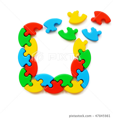 Crumbling frame of colored puzzles 47845981