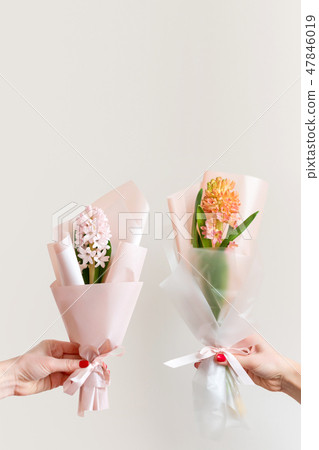 Woman hands with manicure holding spring flowers. Fresh bouquets with hyacinth. Copyspace for text Woman hands with manicure holding spring flowers. Fresh bouquets with hyacinth. Copyspace for text 47846019