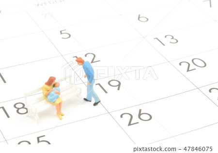 A calendar and a couple A calendar and a couple 47846075